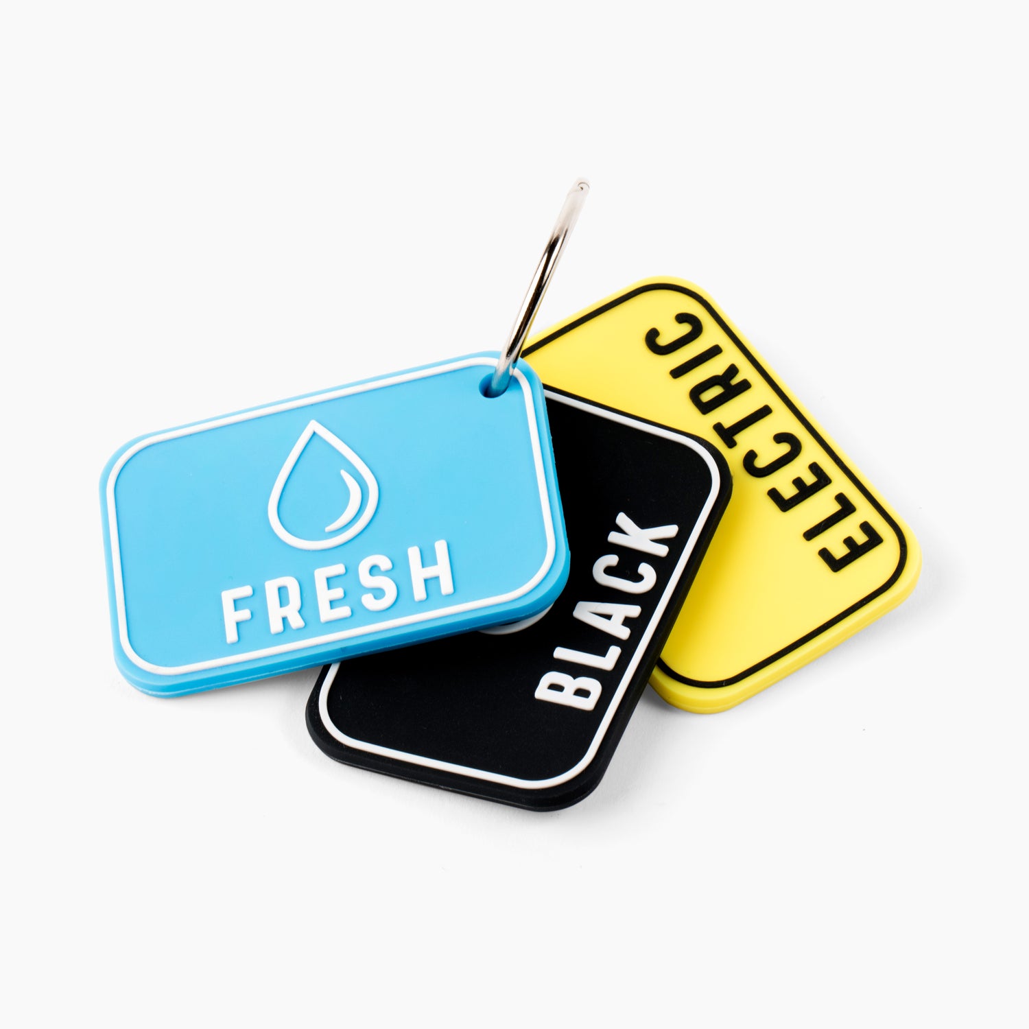 Set of three RV hose bag labels: blue 'Fresh,' black 'Black,' and yellow 'Electric,' attached to a metal ring. These essential RV accessories help in organizing hoses by clearly marking them for fresh water, black water, and electric use. Ideal for travel trailers and mobile homes, these labels prevent hose mix-ups and contamination. The labeled hose bags are crucial camper accessories for RV camping, ensuring proper identification and maintaining cleanliness in RV supplies.